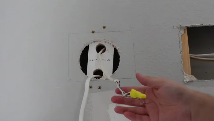 Run wires through clamps. Attach the junction box to the wooden piece and add the light fixture mounting plate.