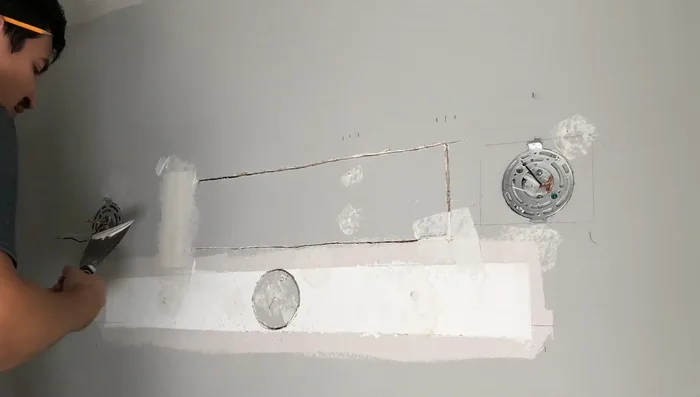 Apply and smooth drywall compound, create knockdown texture.