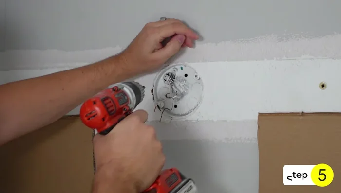 Measure the exact center point of the new light fixture locations. Use a 4-inch hole saw and hole saw bowl to cut holes in the drywall.