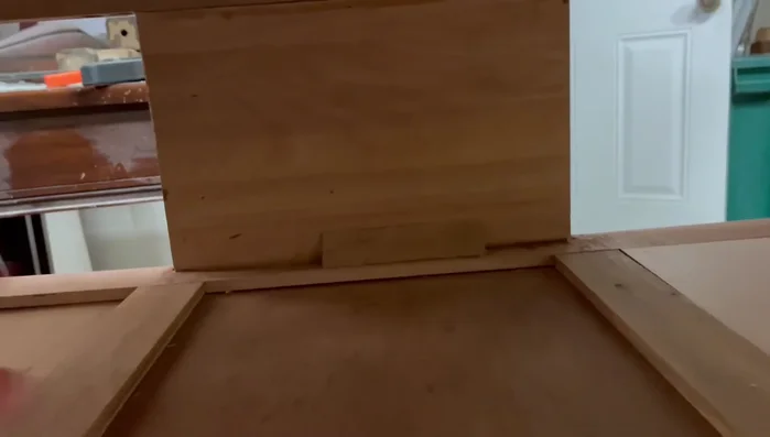 Glue and nail support blocks to the inside of the dresser to support the butcher block.