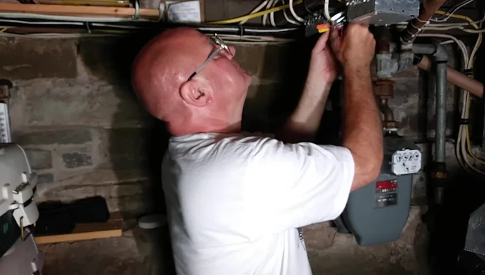 Secure wire connections using wire nuts and electrical tape. Ensure wires are neatly organized and evenly trimmed.