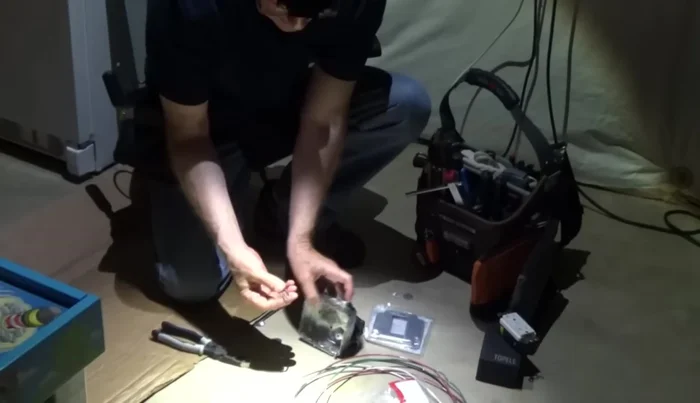 Slide the box spacers into the service panel and connect with nuts.