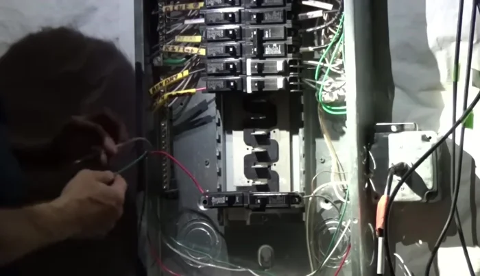 Remove the knockout for the new breaker.