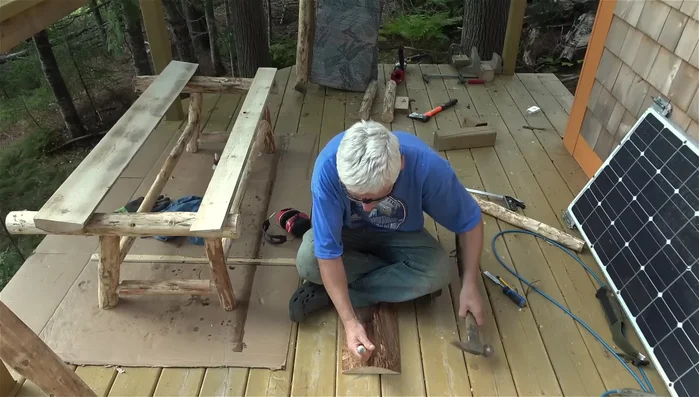 Create notches in the slab boards using a miter saw to create guidelines and a chisel to carve the curve.