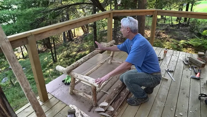 Create and install the back posts, drilling perpendicularly then angling the cut.