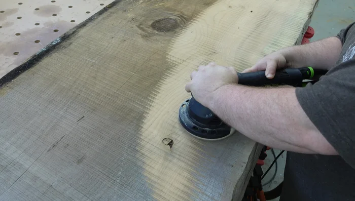 Use a hand plane to smooth out high spots. Apply candle wax to the plane's sole to reduce friction.