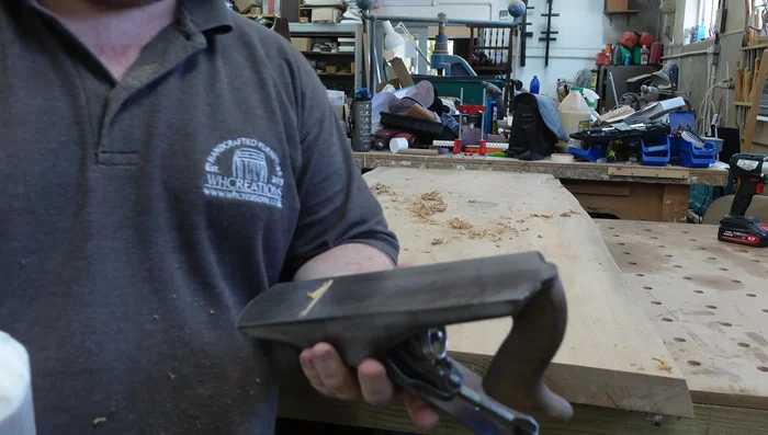 Use a hand plane to smooth out high spots. Apply candle wax to the plane's sole to reduce friction.