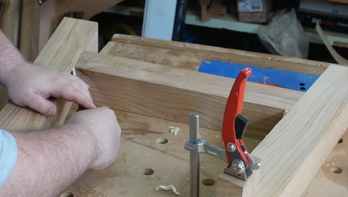 Glue and clamp the leg frames. Scrape off excess glue once cured.