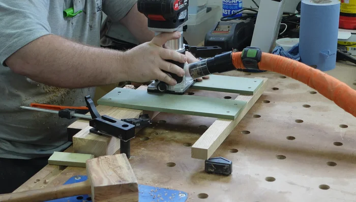 Cut half-lap joints on the top stretcher using a simple jig. Plane off burn marks.