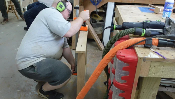 Drill holes for threaded inserts using a drill press.