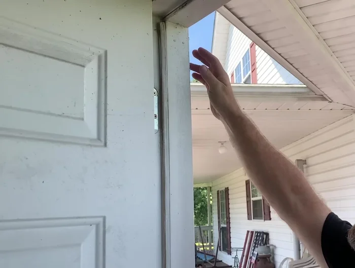 Secure the door to the frame to prevent movement.