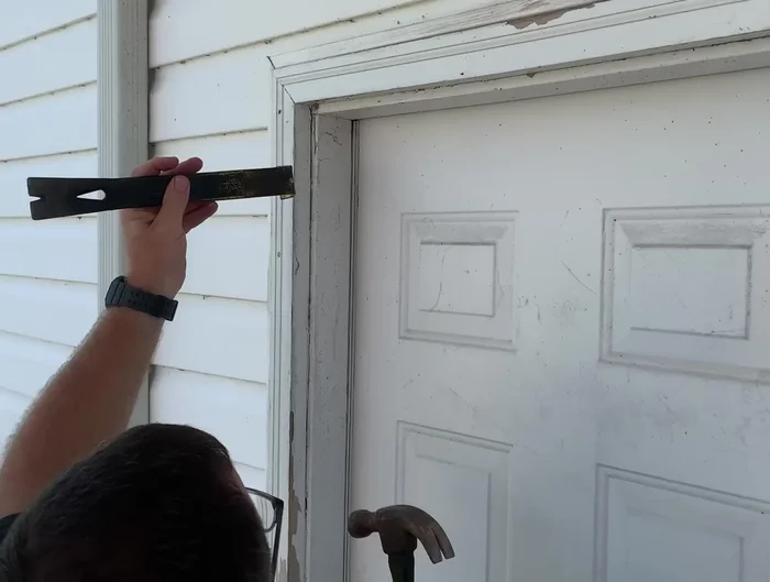 Secure the door to the frame to prevent movement.