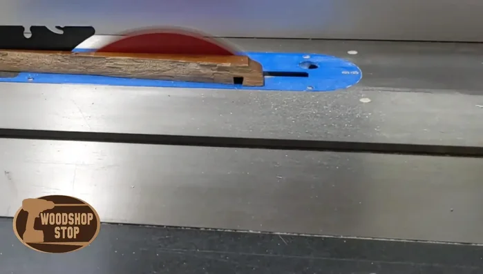 Cut the existing drawer face piece square using a table saw.