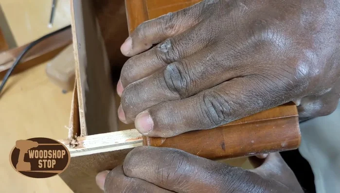Remove the broken drawer face from the drawer.