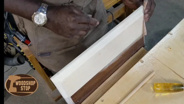 Reinstall the repaired drawer face into the drawer.