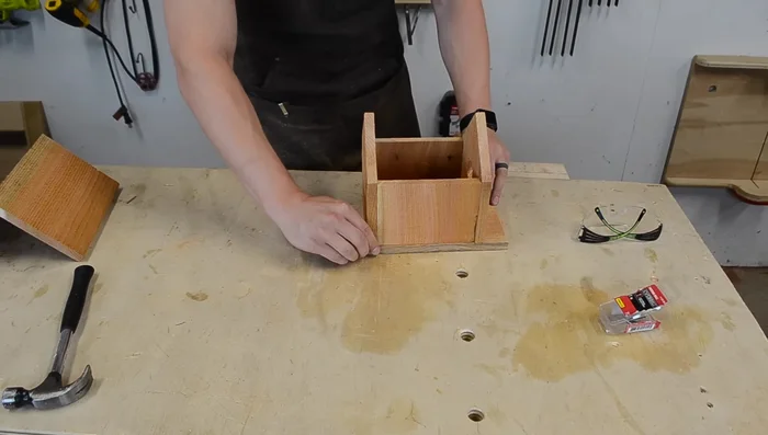 Attach the bottom piece, ensuring the back is aligned with the back of the house.