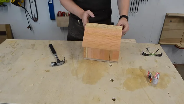 Attach the roof, ensuring the back is flush with the back of the house.