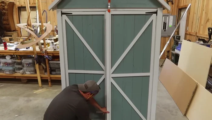 Install trim and fix gap between doors with an overlay board.