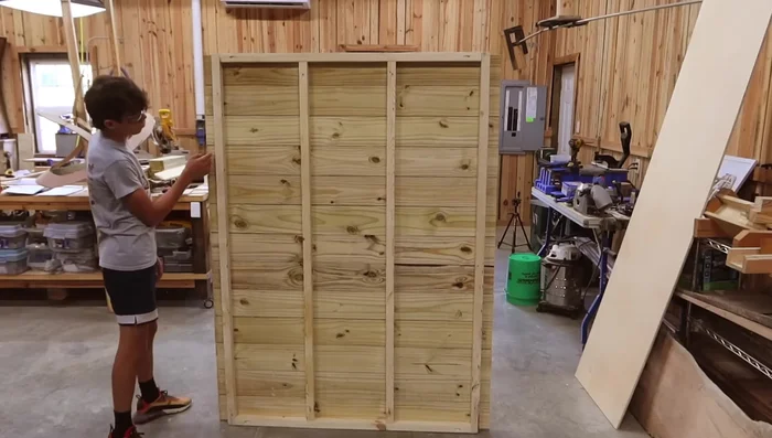 Assemble main frame: Attach side and back walls, using 2 1/2-inch screws.