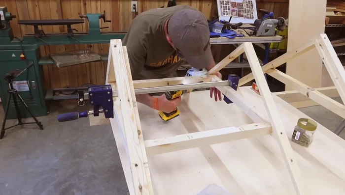 Install false front truss.