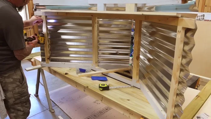 Install trim and shiplap to doors.