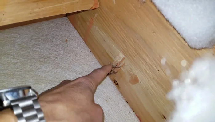 Drill screws to attach the L-brackets securely.