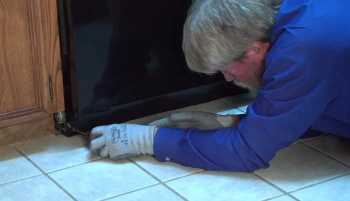If leaks persist under the dishwasher, remove the bottom panels to access bottom components.