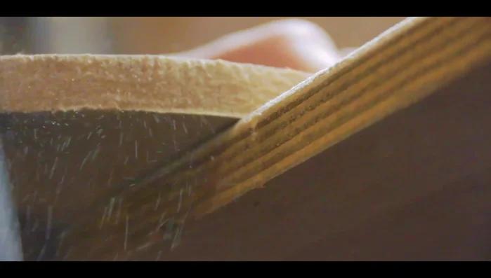 Sand the edges to remove any roughness and break sharp edges to improve paint adhesion.