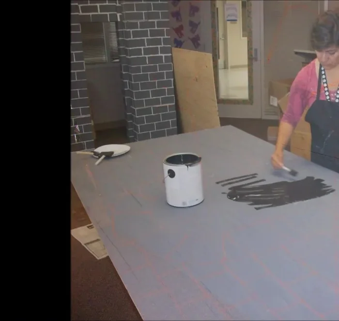 Paint the other wood panel gray, and add dark archway details.