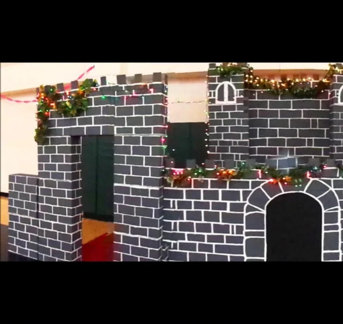 Add brackets to the back of the wood panels to secure them to the castle structure and prevent them from falling.