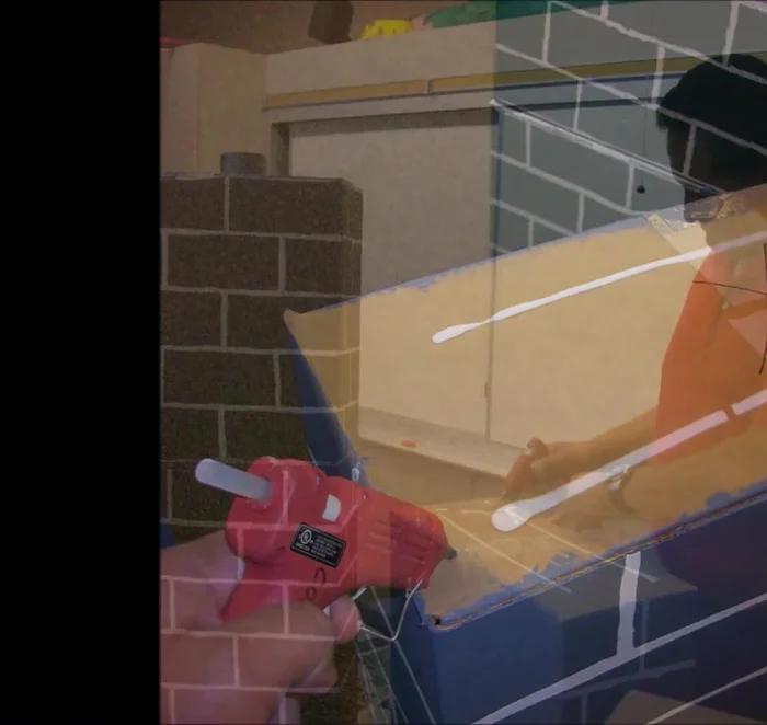 Glue all the boxes together to form the towers. Use an electric glue gun and/or tape to secure the pieces until the glue sets.