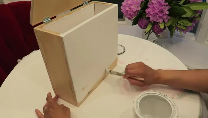 Paint the entire dispenser white (or any desired color).