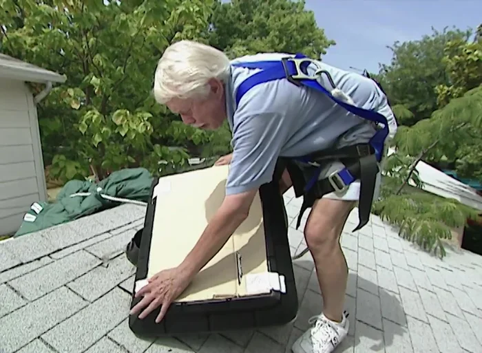 Place cardboard over the solar panels to prevent accidental fan activation before final installation.