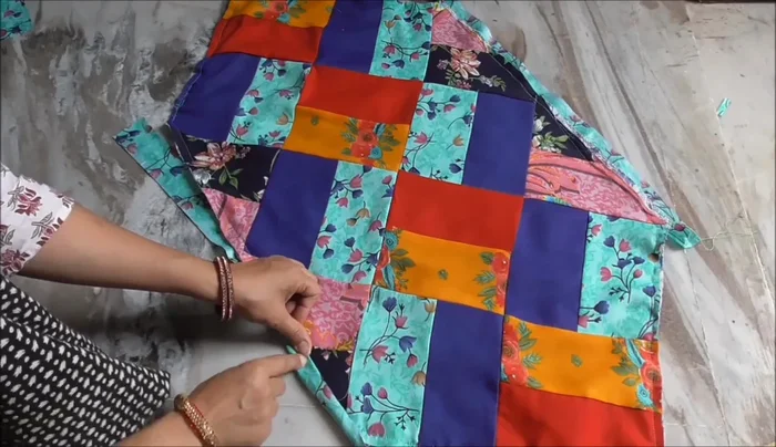 Finish the corners neatly by folding and stitching the fabric strip.