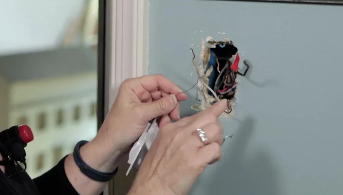 Connect the ground wires (including the secondary ground if present) together, wrap around the copper ground from the house, and secure with an electrical cap and tape.