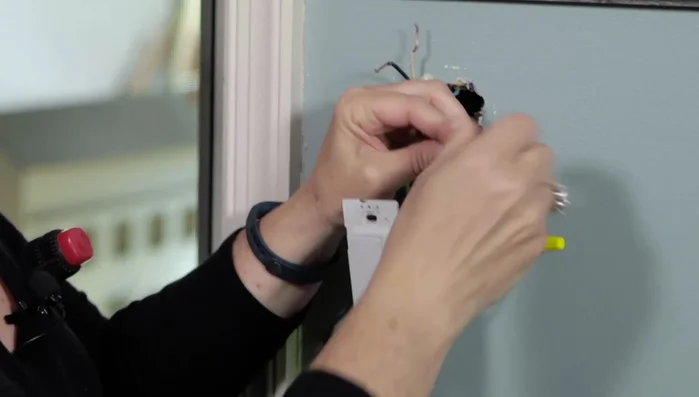 Connect the remaining wires (following the instructions provided with your specific switch) using electrical caps and tape. Ensure wires are tucked in and no metal is exposed.