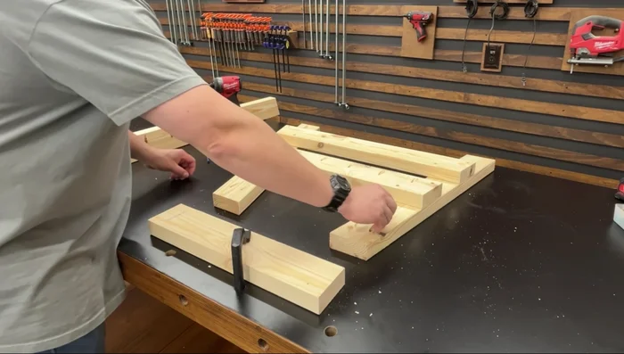 Attach the backrest support: Position the backrest support flush against the bottom support and top corner of the seat support, fasten with 2-inch wood screws.