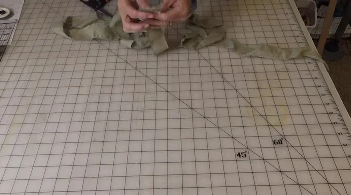 Prepare fabric strips: Cut fabric into 1.5-inch strips. Join strips together using a simple overlapping and tucking method (see detailed instructions at 99.2).