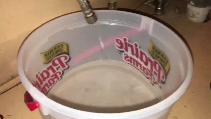 Inspect the bucket for any debris that came out of the hose. 