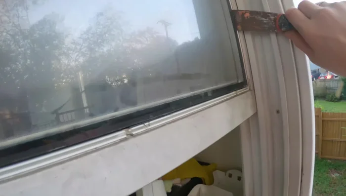 Clean the window frame. Remove any remaining silicone or debris from the window frame using a razor blade (wear gloves!).