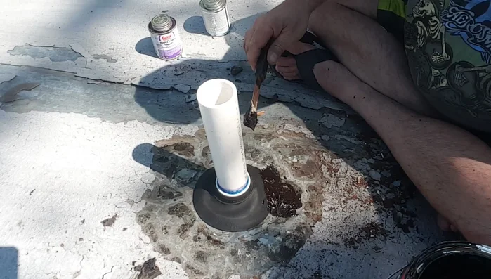 Feather out the tar to create a smooth, weatherproof seal.
