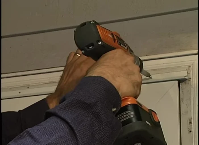 Install the top mounting frame, followed by the side frames, securing them with screws.