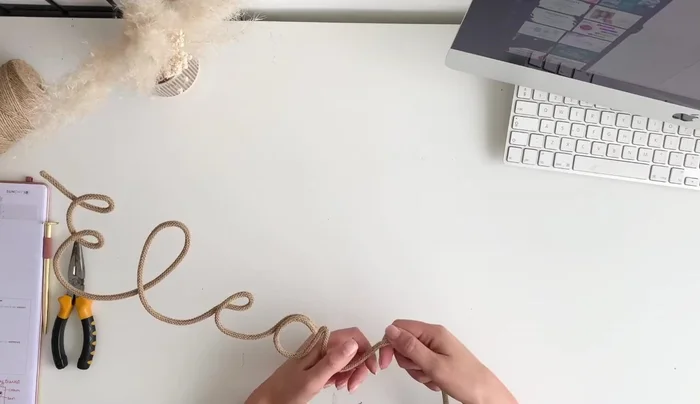 Connect the letters, adjusting as needed to maintain a smooth flow. Don't worry if letters vary slightly in size; consistency in following the font is key.
