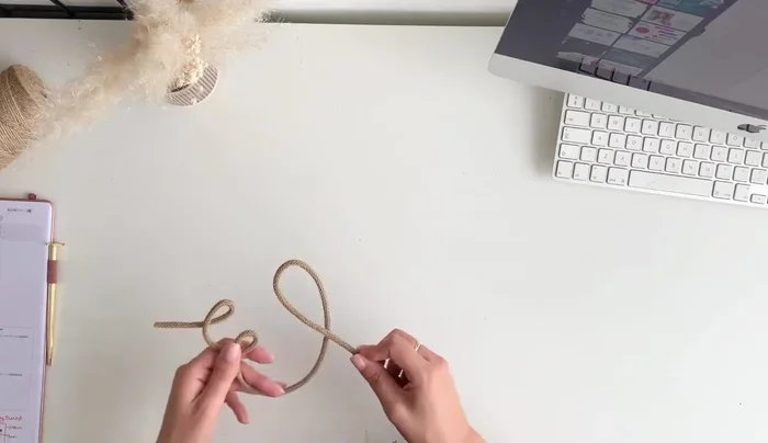 Choose a font (e.g., from Canva). Use the font as a guide to form the letters with the wire.