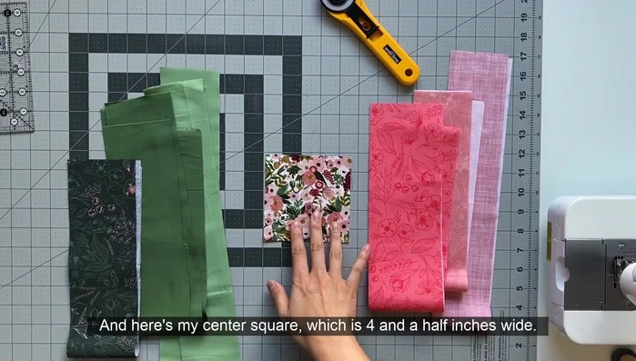 Cut fabric strips ranging from 3 to 3.5 inches wide.