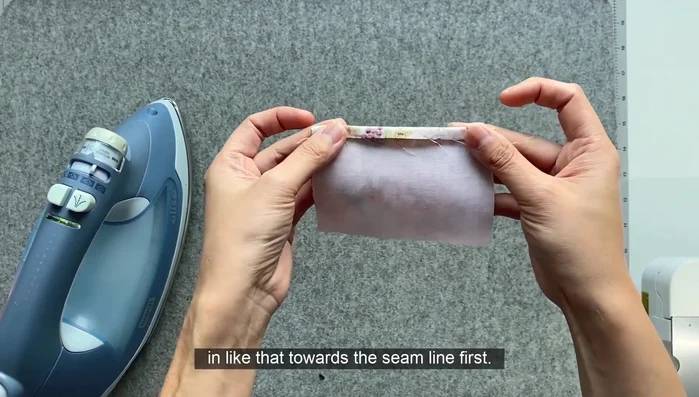 Edge stitch along the folded edge to secure the seam.