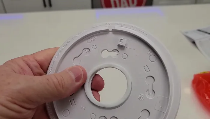 Install the new base, ensuring proper wire connection.