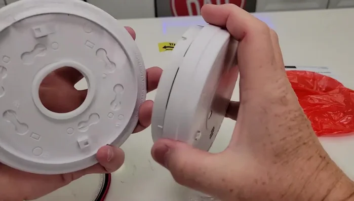 Install the new base, ensuring proper wire connection.