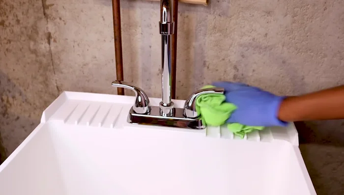 For extra shine, use glass cleaner and polish the faucet (optional).