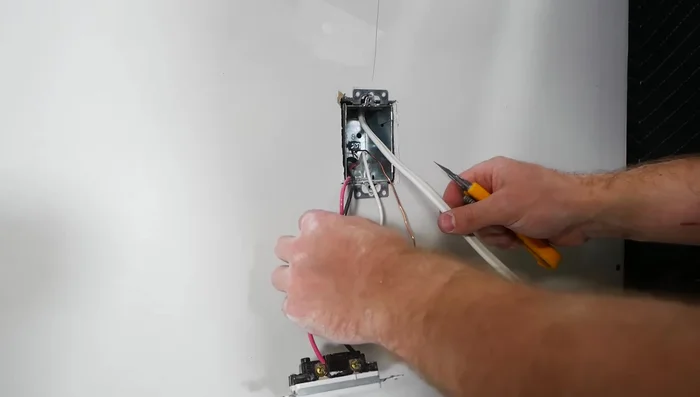 Connect the wires in the switch box (new light fixture wire to the switched hot, neutrals together, grounds together).